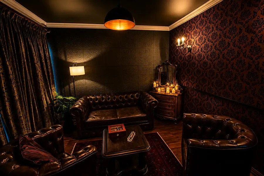 Private Cigar Lounge Set | Boudoir Fusion Photography Johannesburg Elegant private cigar lounge set at Boudoir Fusion Photography's luxury Johannesburg studio, featuring leather Chesterfield seating, rich décor and cinematic lighting for sophisticated boudoir portraits.