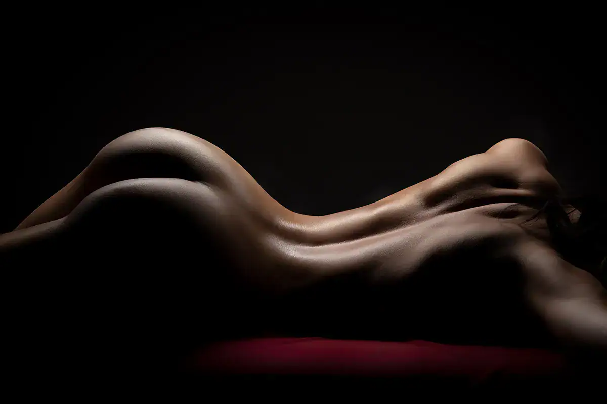 Fine Art Nude Photography Lighting Workshop Fine art nude photography demonstrating low key studio lighting and body sculpting techniques