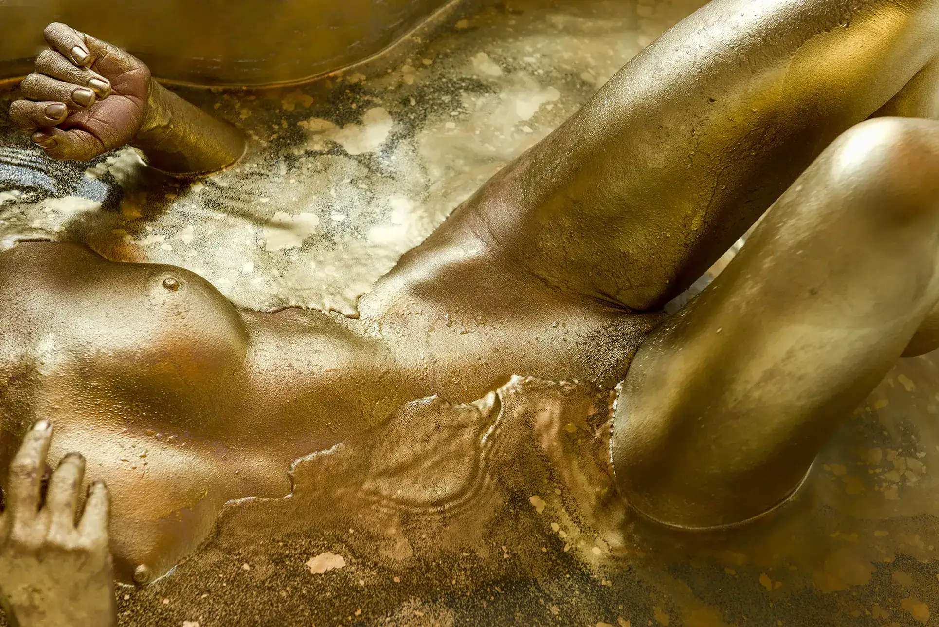 Gold Body Paint Abstract Art Nude Close up of a female form covered in metallic gold body paint creating an abstract artistic nude