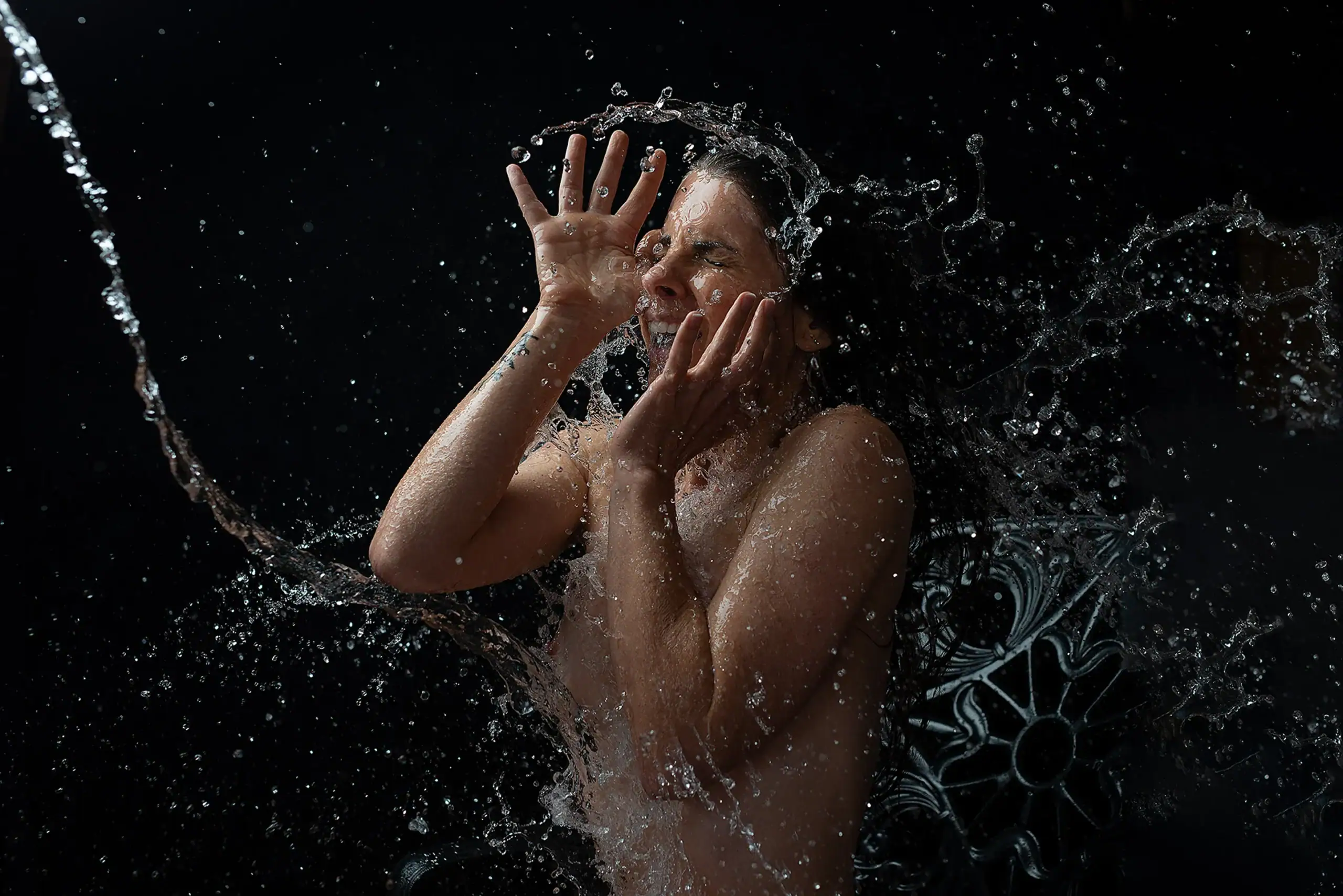 Water Splash Conceptual Photography Woman photographed through a dramatic splash of water in a creative studio portrait