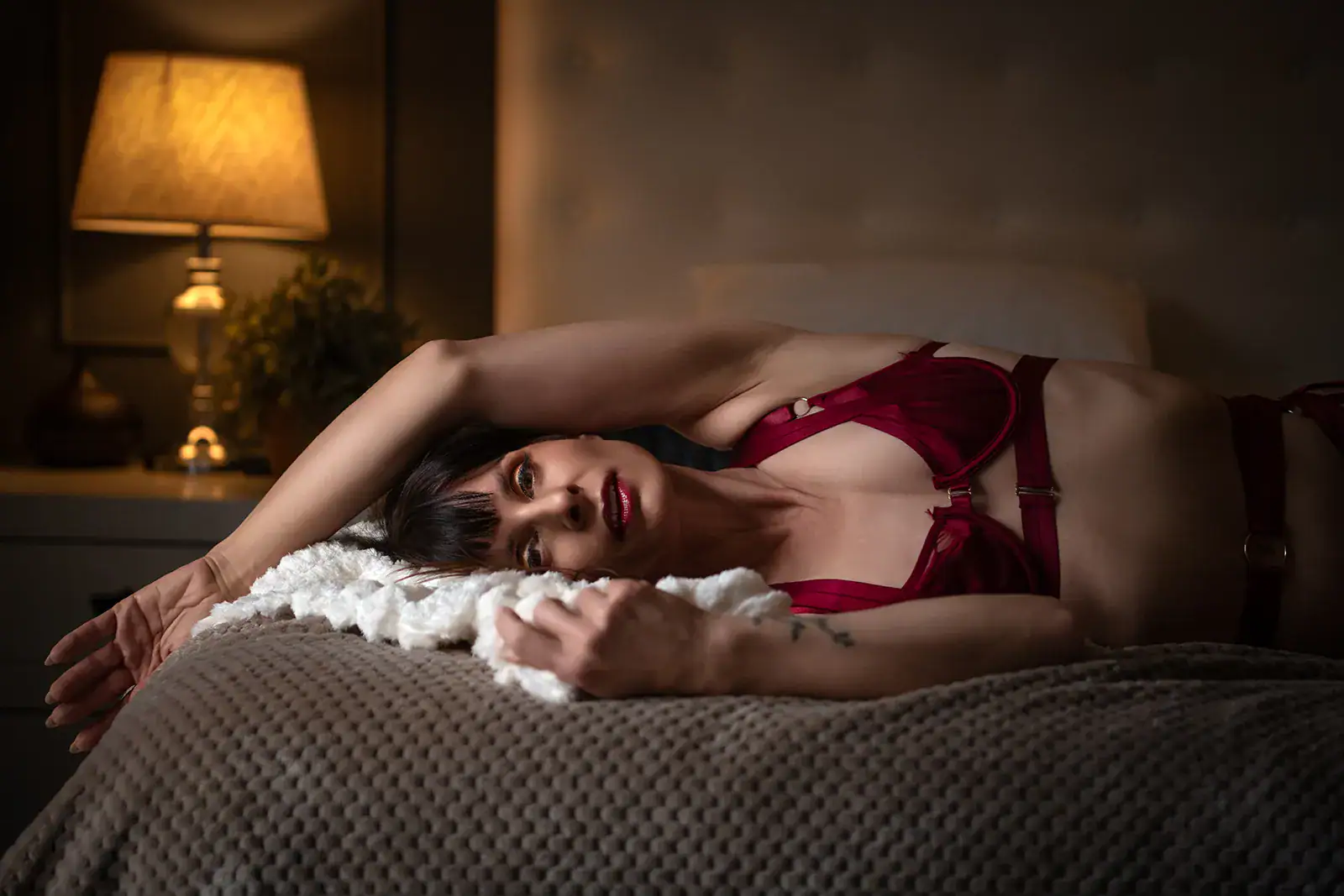 Woman in red lingerie during a sensual boudoir photoshoot in Johannesburg